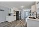 Bright and airy kitchen features stainless steel appliances, white cabinetry, and open floor plan at 308 Stone Throw Dr., Murrells Inlet, SC 29576