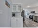 Kitchen area features white cabinets and stainless appliances, blending style with functionality at 308 Stone Throw Dr., Murrells Inlet, SC 29576