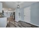 Open living space with gray wood floors and a modern light fixture at 308 Stone Throw Dr., Murrells Inlet, SC 29576