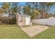 Storage shed featuring a single door and adjacent patio in a spacious backyard at 308 Stone Throw Dr., Murrells Inlet, SC 29576