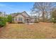 A serene backyard featuring a patio, lush greenery, and ample space for relaxation at 3103 Robyn Ct., Little River, SC 29566