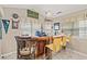 Entertaining bar featuring a leather bar and three chairs, lots of natural light, and a decorated wall at 3103 Robyn Ct., Little River, SC 29566