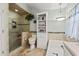 Bright bathroom featuring a glass enclosed tiled shower, commode, soaking tub, and built in linen storage at 3103 Robyn Ct., Little River, SC 29566