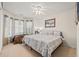 Bedroom with a ceiling fan, a large bed, and windows providing ample natural light at 3103 Robyn Ct., Little River, SC 29566