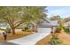 Exterior view of a brick home with a manicured lawn, a brick driveway and a two car garage at 3103 Robyn Ct., Little River, SC 29566