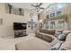 Open-concept living room featuring vaulted ceilings, neutral paint colors, tile flooring, and comfortable seating at 3103 Robyn Ct., Little River, SC 29566