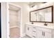 Bathroom features a dual sink vanity with modern fixtures and view to a walk-in closet at 3127 Tiger Tail Rd., Conway, SC 29526