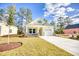 Welcoming one-story home with well-maintained lawn, sunny siding, and an attached one car garage at 3127 Tiger Tail Rd., Conway, SC 29526