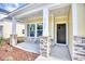 Quaint front porch featuring stone pillar accents, a covered entrance, and tidy landscaping at 3127 Tiger Tail Rd., Conway, SC 29526