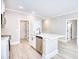 Kitchen featuring a center island with sink, stainless steel appliances, and wood grain floors at 3127 Tiger Tail Rd., Conway, SC 29526