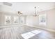 Spacious living room filled with natural light, featuring light-colored walls and wood grain floors at 3127 Tiger Tail Rd., Conway, SC 29526