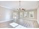 Spacious living room with sliding glass door, ceiling fan, and lots of natural light from windows at 3127 Tiger Tail Rd., Conway, SC 29526