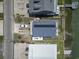Aerial view of a home with solar panels, waterfront access, and ample parking space on a sunny day at 315 60Th Ave. N, North Myrtle Beach, SC 29582