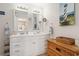 Bright bathroom features double sinks, mirrors, vanity, and decor at 315 60Th Ave. N, North Myrtle Beach, SC 29582