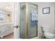 Bathroom view shows shower stall and toilet with bedroom in background at 315 60Th Ave. N, North Myrtle Beach, SC 29582