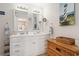 Bright bathroom features double sink vanity, decorative mirrors, and ample storage at 315 60Th Ave. N, North Myrtle Beach, SC 29582