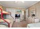 Bedroom featuring a bunk bed, queen bed, wood paneled walls, and a closet at 315 60Th Ave. N, North Myrtle Beach, SC 29582
