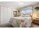 Nautical-themed bedroom featuring a queen bed, wood paneled walls, and a large window at 315 60Th Ave. N, North Myrtle Beach, SC 29582