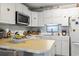 Well-lit kitchen with white cabinets, modern appliances, and an island counter for meal preparation at 315 60Th Ave. N, North Myrtle Beach, SC 29582