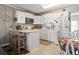 Functional kitchen featuring white cabinetry, modern appliances, and a convenient island counter at 315 60Th Ave. N, North Myrtle Beach, SC 29582