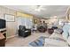 Spacious living area offering comfortable seating, a workspace, and an open view of the kitchen at 315 60Th Ave. N, North Myrtle Beach, SC 29582