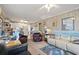 Open-concept living area with views of the dining area and kitchen featuring neutral tones and ceiling fans at 315 60Th Ave. N, North Myrtle Beach, SC 29582