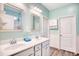 Bright bathroom with a double sink vanity, decorative mirrors, and ample cabinet space at 321 Rycola Circle, Surfside Beach, SC 29575