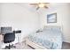 Bedroom with desk, chair, beach-themed artwork, and a patterned bedspread at 321 Rycola Circle, Surfside Beach, SC 29575