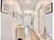 Inviting foyer with light gray walls and wood flooring, decorated with artwork and furnishings at 321 Rycola Circle, Surfside Beach, SC 29575