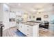 Well-lit kitchen with an island, stainless steel appliances, granite countertops, and an open floor plan at 321 Rycola Circle, Surfside Beach, SC 29575