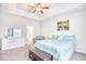 Tranquil main bedroom features a tray ceiling, plush carpet, and a comfortable sitting area at 321 Rycola Circle, Surfside Beach, SC 29575