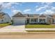 Charming single-story home featuring a two-car garage, manicured lawn and welcoming front entrance at 3321 Little Bay Dr., Conway, SC 29526