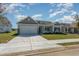 Charming single-story home featuring a two-car garage, manicured lawn and welcoming front entrance at 3321 Little Bay Dr., Conway, SC 29526