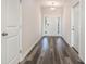 Bright hallway with wood-look floors leading to a welcoming front door with sidelights at 3321 Little Bay Dr., Conway, SC 29526