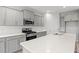 Modern kitchen with stainless steel appliances, white countertops and grey cabinets at 3332 Little Bay Dr., Conway, SC 29526