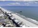 Aerial view of beachfront homes, sandy shoreline, and ocean at 342 Dogwood Dr. S, Murrells Inlet, SC 29576