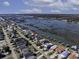 Aerial view of waterfront property, with boat docks, serene waterways, and picturesque coastline at 342 Dogwood Dr. S, Murrells Inlet, SC 29576