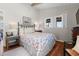 Guest bedroom featuring a floral quilt, wood floors, and neutral tones at 342 Dogwood Dr. S, Murrells Inlet, SC 29576