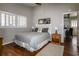 Neutral bedroom features hardwood floors, and a large window at 342 Dogwood Dr. S, Murrells Inlet, SC 29576