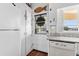 Kitchen area featuring a door to the outside, white appliances, and granite countertops at 342 Dogwood Dr. S, Murrells Inlet, SC 29576