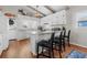 Well-lit kitchen with breakfast bar, granite countertops, and stainless steel appliances at 342 Dogwood Dr. S, Murrells Inlet, SC 29576