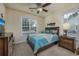 Cozy bedroom featuring natural light from two windows, ceiling fan, and coastal decor at 3507 Club Course Dr., North Myrtle Beach, SC 29582