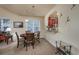 Cozy dining area featuring a wooden table set for four, with view into an open kitchen and stylish decor at 3507 Club Course Dr., North Myrtle Beach, SC 29582