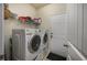 Laundry room with white washer and dryer, wire shelving, and access to the exterior at 3507 Club Course Dr., North Myrtle Beach, SC 29582