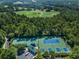 Aerial view of tennis and pickleball courts surrounded by greenery at 3507 Club Course Dr., North Myrtle Beach, SC 29582