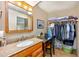 Full bathroom with a granite vanity, ample storage, and a built-in closet for towels and toiletries at 400 20Th Ave. N # 101, Myrtle Beach, SC 29577