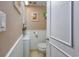 Bathroom with washer/dryer combo and white wainscoting at 400 20Th Ave. N # 101, Myrtle Beach, SC 29577