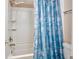 Bathroom featuring a shower/tub combination with a decorative blue seashell curtain at 400 20Th Ave. N # 101, Myrtle Beach, SC 29577