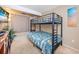 Bedroom with a bunk bed with a metal frame and beach-themed bedding at 400 20Th Ave. N # 101, Myrtle Beach, SC 29577