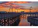 Scenic view of the boardwalk at sunset with colorful skies and calm waters at 400 20Th Ave. N # 101, Myrtle Beach, SC 29577